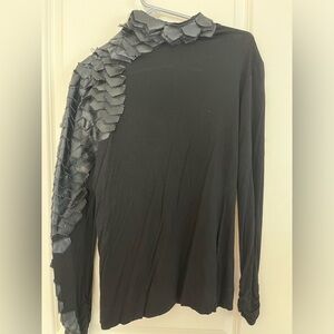 Unique mock turtleneck with faux leather scales, gathered cuffs